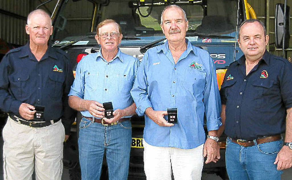Award recipients Ron Follett, Bill Janke and David Barsley with Widgee Rural Fire Brigade president Rob Lonergan. Award recipients Ron Follett, Bill Janke and David Barsley with Widgee Rural Fire Brigade president Rob Lonergan.
